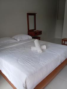 Postel nebo postele na pokoji v ubytování Abhi hotel