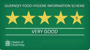 a green sign with five gold stars on it at Le Chene Hotel in St Peter Port