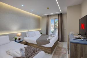 Voodi või voodid majutusasutuse Khattab Pyramids View Hotel toas