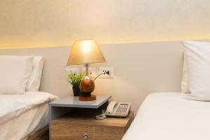 Voodi või voodid majutusasutuse Khattab Pyramids View Hotel toas