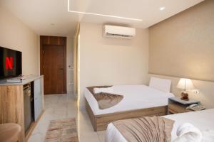 Voodi või voodid majutusasutuse Khattab Pyramids View Hotel toas