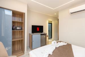 Televiisor ja/või meelelahutuskeskus majutusasutuses Khattab Pyramids View Hotel