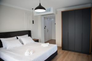 Postel nebo postele na pokoji v ubytování Hotel Luciano