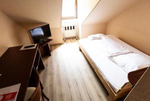 Voodi või voodid majutusasutuse Hotel-Restaurant Zum Schwalbennest toas