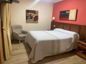 Posteľ alebo postele v izbe v ubytovaní Hostal Carmen