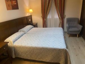Posteľ alebo postele v izbe v ubytovaní Hostal Carmen
