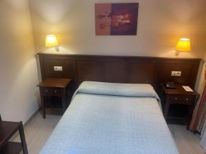 Posteľ alebo postele v izbe v ubytovaní Hostal Carmen