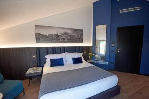 Postel nebo postele na pokoji v ubytování Hotel Leonessa