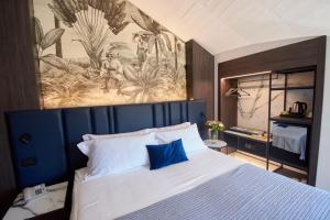 Postel nebo postele na pokoji v ubytování Hotel Leonessa