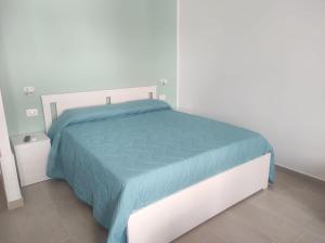 Postel nebo postele na pokoji v ubytování Cirella House