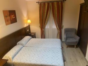 Posteľ alebo postele v izbe v ubytovaní Hostal Carmen