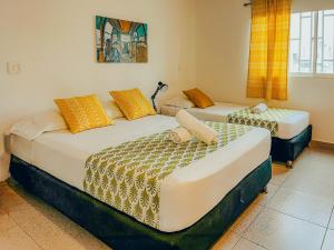 Cama ou camas em um quarto em Viajero San Andres Hostel