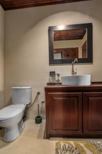 a bathroom with a toilet and a sink at Telegraphus Boutique Home in Skiathos +20 photos