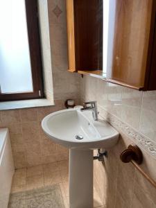 a bathroom with a white sink and a window at Bed & Breakfast Casa Galeano in Pizzo +23 photos