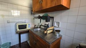 Een keuken of kitchenette bij Tagua Hospedaje