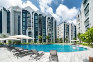 an image of a swimming pool in front of buildings at The Halo 1 Naiyang Beach in Nai Yang Beach