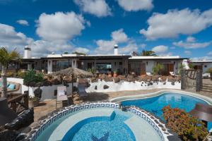 a view of a house with a swimming pool at Lanzahost Luxury Finca Paraiso in Tías