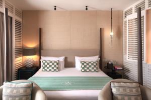 Le Barthélemy Hotel & Spa客房内的一张或多张床位