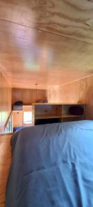Ein Bett oder Betten in einem Zimmer der Unterkunft Rumi Azulada - La Calera