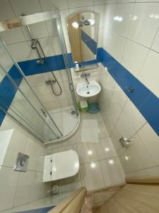 a bathroom with a sink and a shower and a toilet at Altona in Władysławowo +40 photos