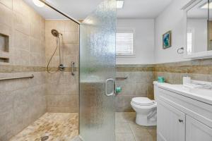 a bathroom with a shower and a toilet at Hamilton Home Playground 2BR in Lexington +25 photos