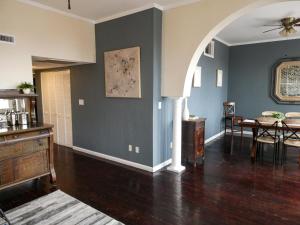 a living room with a table and a dining room at Telfair Place - 2BR Loft Overlooking Broughton Street in Savannah