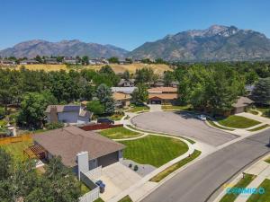an aerial view of a residential neighborhood with mountains at Lost Creek by Conmigo in Sandy