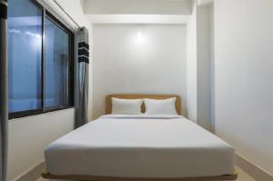 Hotel Gyan Regency客房内的一张或多张床位