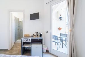 TV a/nebo společenská místnost v ubytování Cavour Rooms