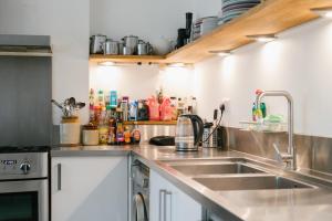 a kitchen with a sink and a counter top at EBS London Stay in Catford