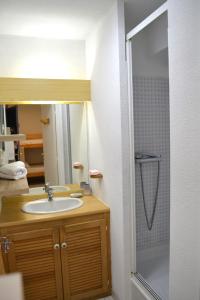 a bathroom with a sink and a shower at Le cabanon de Mirza in Sète +14 photos