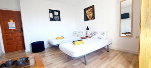 Posteľ alebo postele v izbe v ubytovaní Casa Ridao-Habitación Buddha con vistas