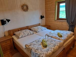 Posteľ alebo postele v izbe v ubytovaní Ranczo w Dolinie