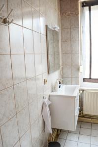 Koupelna v ubytování 4N Appartement + 14 fotografií