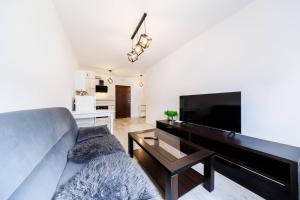 Kuchyň nebo kuchyňský kout v ubytování Cozy New Town Apartment- City Centre Rzeszow by StayNest