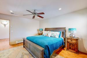 a bedroom with a bed and a ceiling fan at Del Norte Manor Unit B in Santa Fe