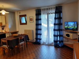 TV a/nebo společenská místnost v ubytování CIVICO 43 Interno 11