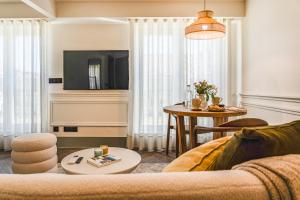 a living room with a couch and a table at Hygge House Downtown in Lisbon