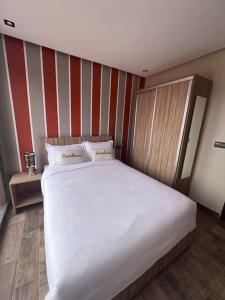 Postel nebo postele na pokoji v ubytování Appartement No 6 vue sur mer au loin