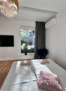 a bedroom with a large bed and a window at Kalna iela 21 apartment in Sigulda
