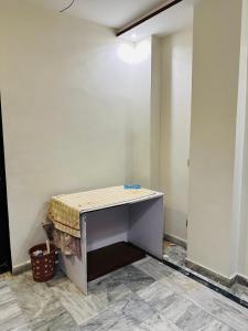 a room with a table with a towel on it at The Luxury Girls Hostel- LDA Avenue in Lahore
