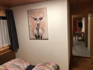a painting of a deer hanging on a wall at Bergesrueh in Malix
