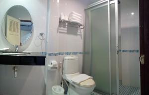 a bathroom with a toilet and a mirror and a shower at Pro Andaman Place in Karon Beach