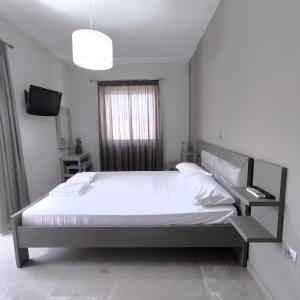 Posteľ alebo postele v izbe v ubytovaní VASO'S APARTMENTS