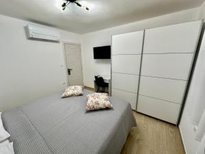 Postel nebo postele na pokoji v ubytování Apartments Marijan & Marija