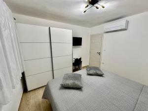 Postel nebo postele na pokoji v ubytování Apartments Marijan & Marija