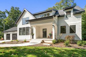 a home with a white house at Beach Glass Retreat - Pickleball, Lake access 2 minute walk away, luxury home in Fennville