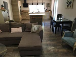 a living room with a couch and a table at Villa SChic in Marseille