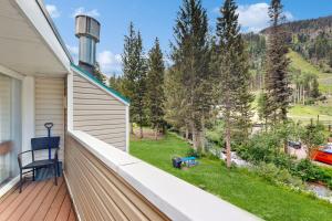 a balcony with a view of a yard at Sierra Del Sol 10 in Taos Ski Valley