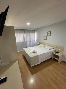Postel nebo postele na pokoji v ubytování Harbor Buriti Hotel